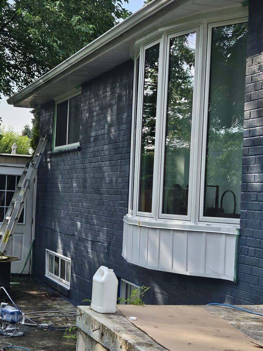 Brick wall with bay window, after