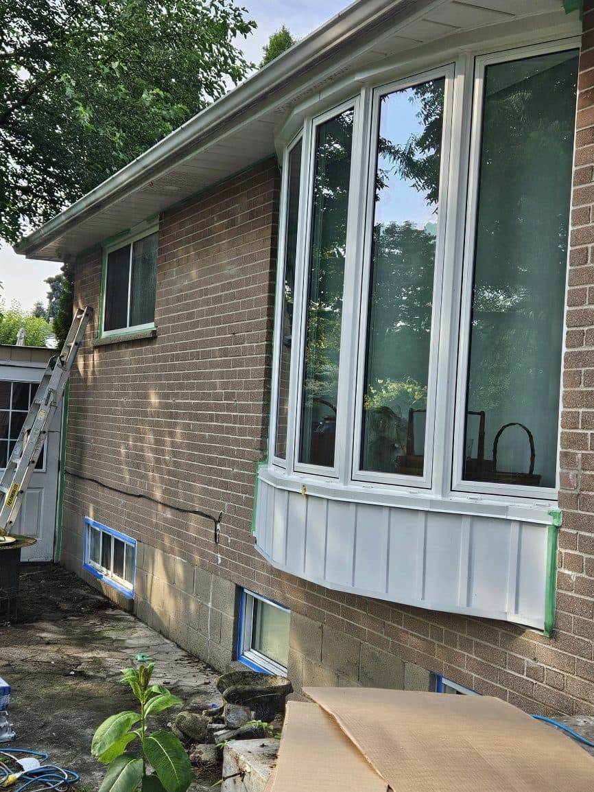 Brick wall with bay window, before